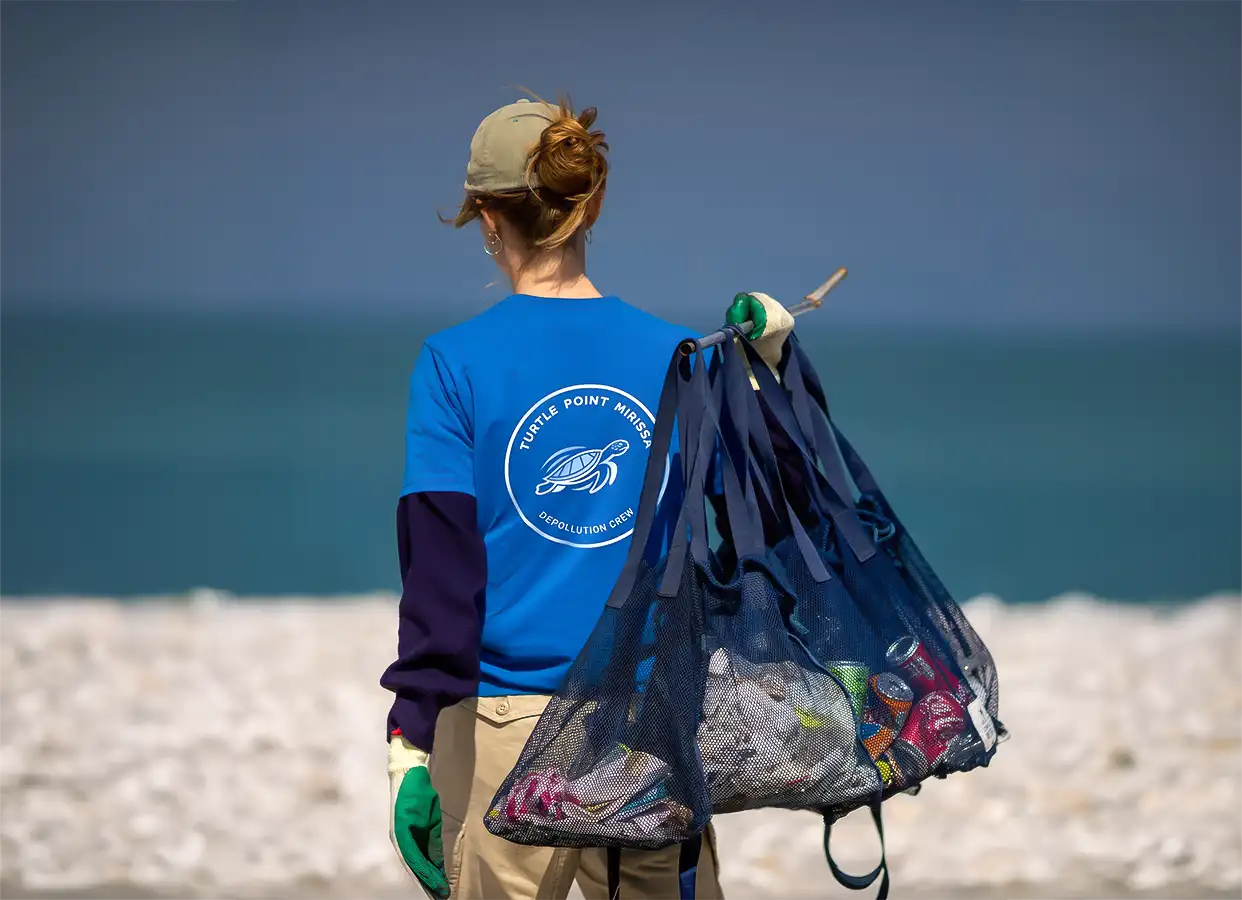 Eco friendly beach cleanup team member protecting marine life